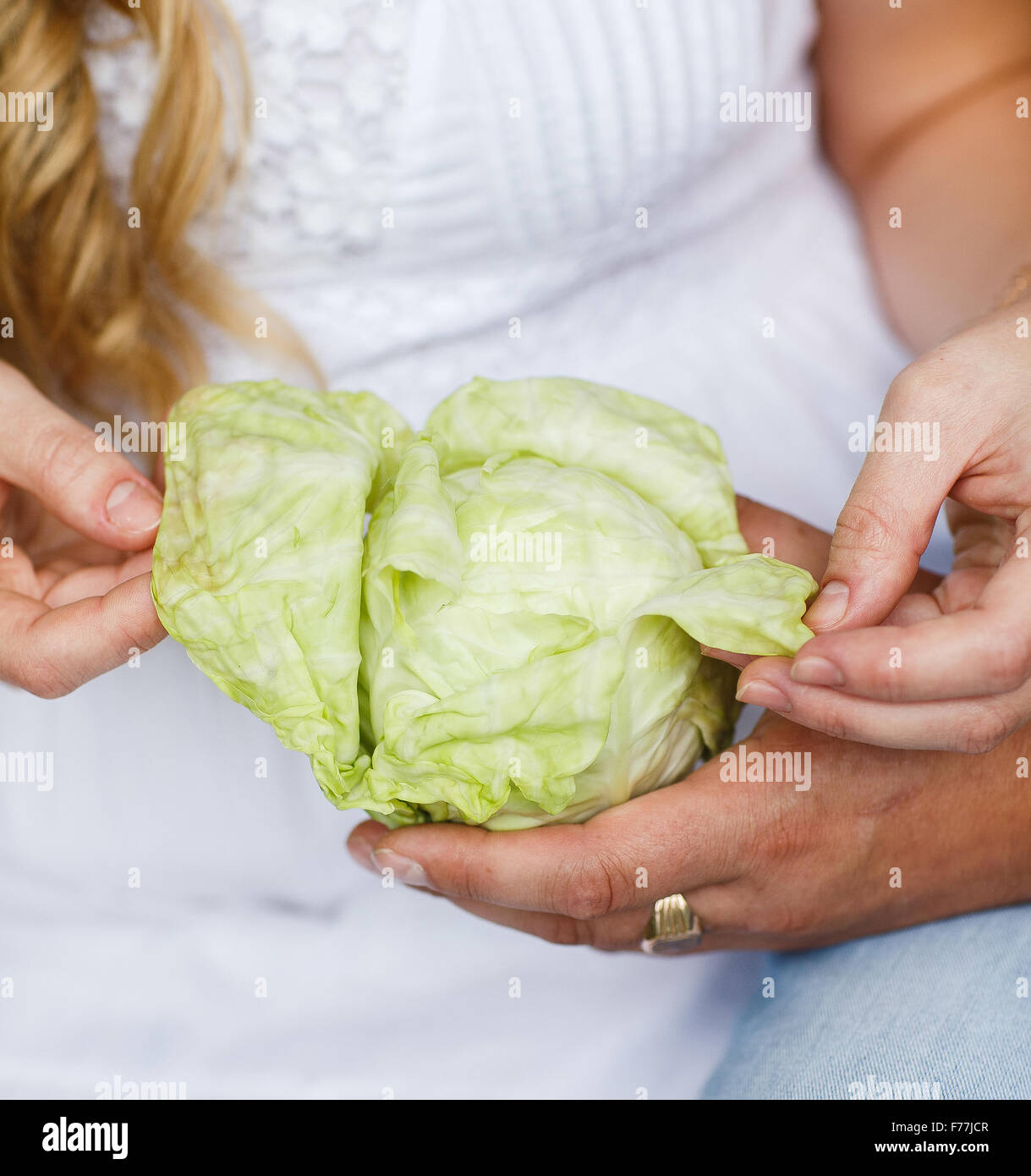 Cabbage is in the hands of the pregnant girl Stock Photo Alamy