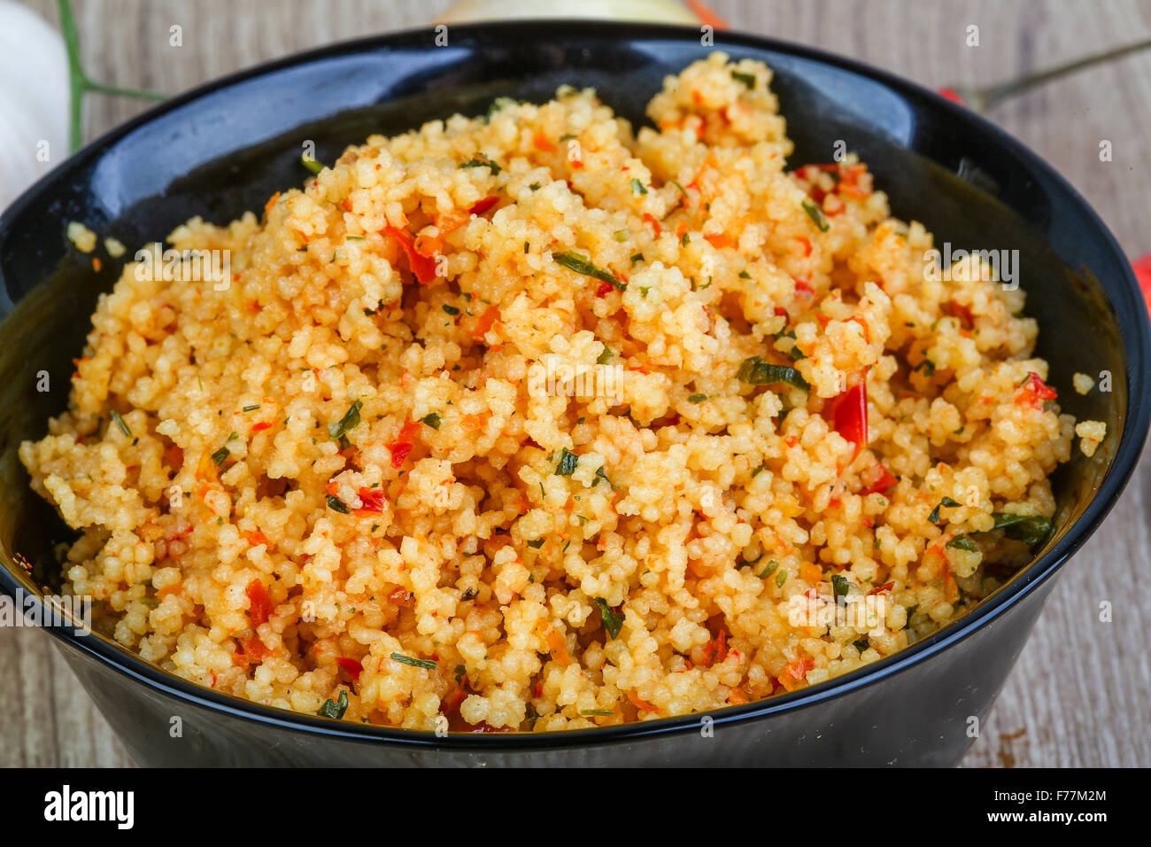 Arabic traditional cuisine Couscous with tomato and green onion Stock