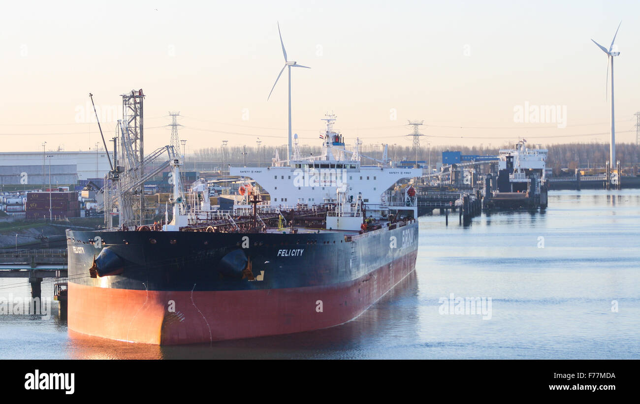 North Sea, Felicity crude oil tanker in Rotterdam harbour at sunrise with shipping, bulk containers tugs Stock Photo