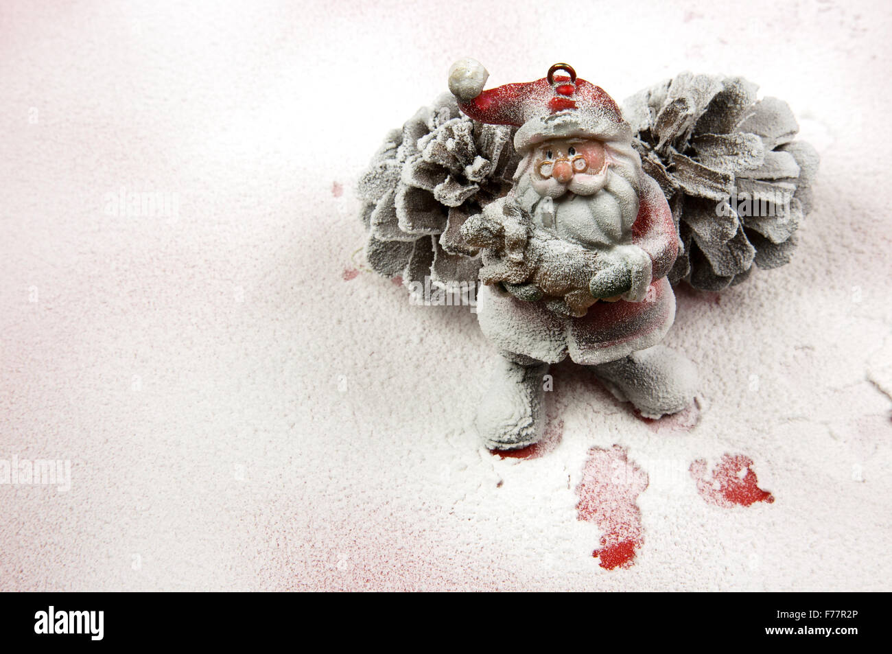 Christmas Decorationsanta Claus Figurine Based On Two Large Spruce Cones On Snow Covered Red Surface And In The Footsteps Of S Christmas Decorationsanta Claus Figurine Based On Two Large Spruce Cones On Snow Covered Red Surface And In The Footsteps Of S