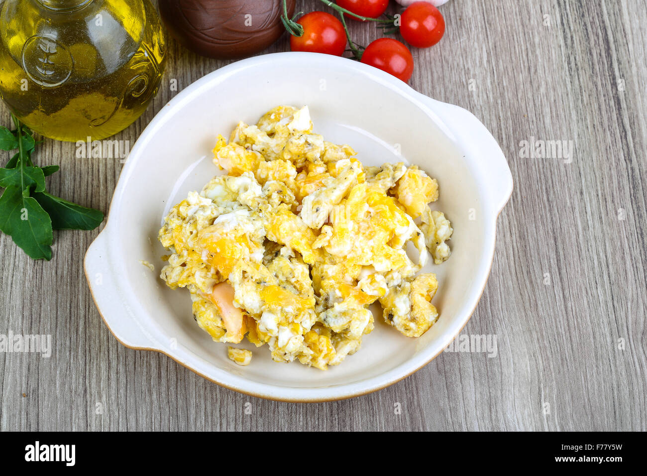 Scrambled eggs for breakfast on the wood background Stock Photo - Alamy