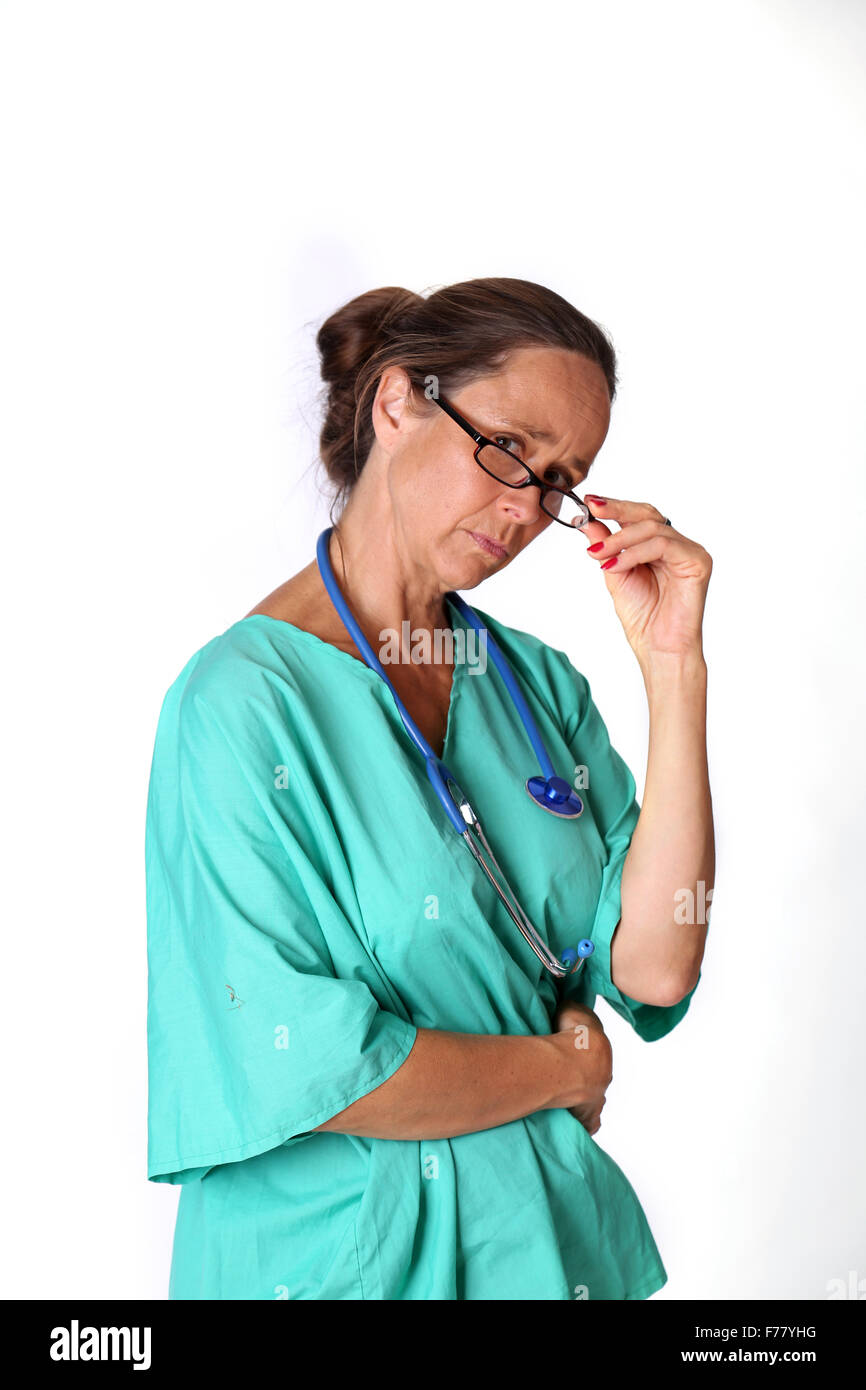 July 2015 - Mature retired Doctor returning to work as requested by the UK government Stock Photo