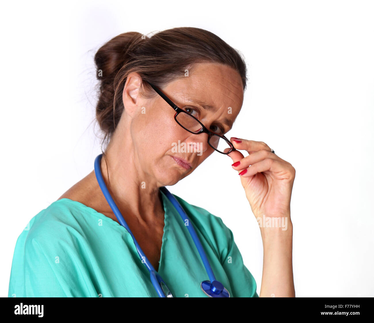 July 2015 - Mature retired Doctor returning to work as requested by the UK government Stock Photo