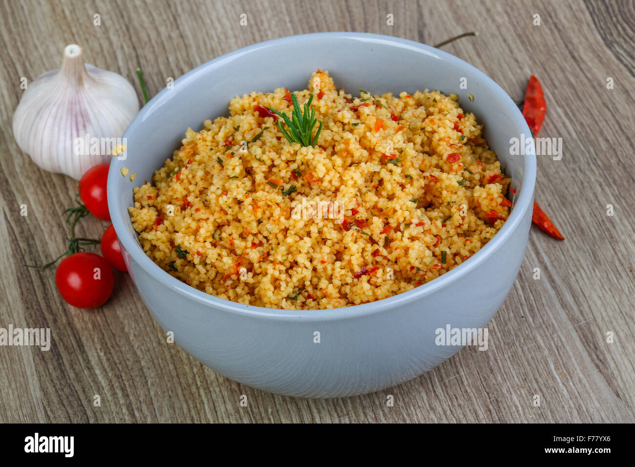Arabic traditional cuisine Couscous with tomato and green onion Stock