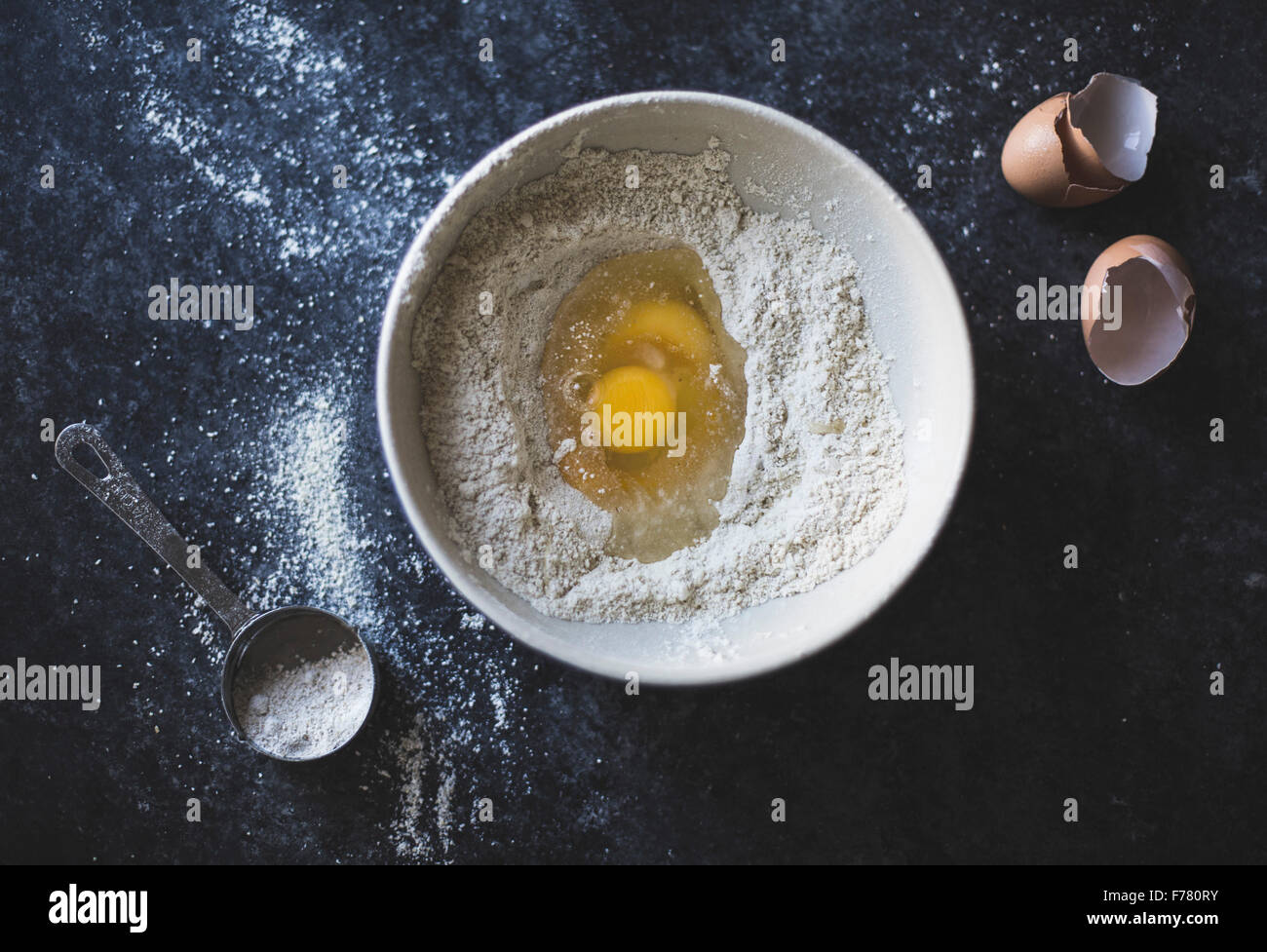 Mixing eggs and flour in bowl hi-res stock photography and images