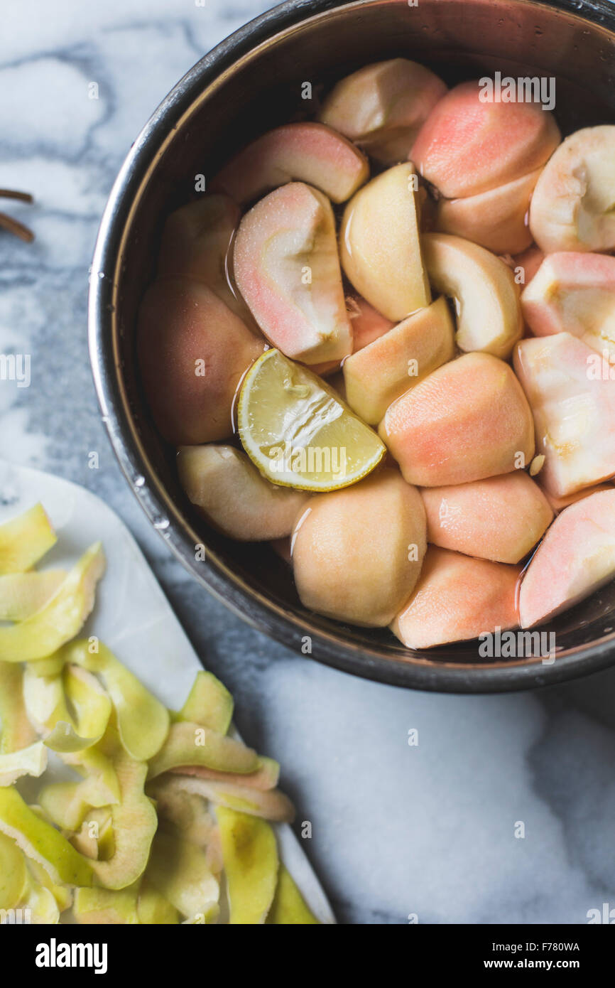 Apples peeled and prepared for cooking Stock Photo