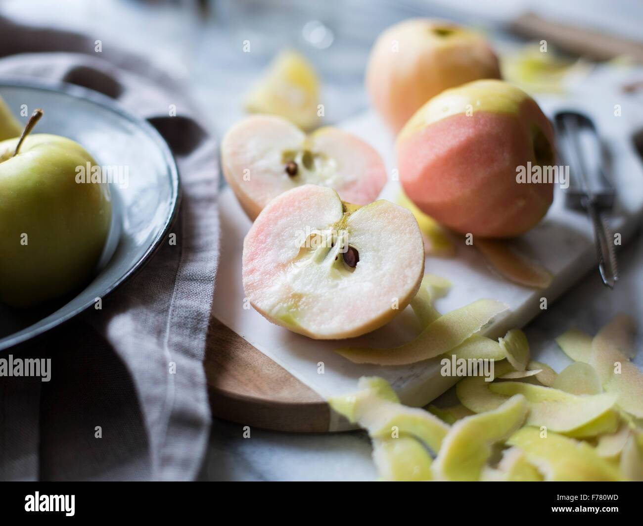 Apples peeled and prepared for cooking Stock Photo