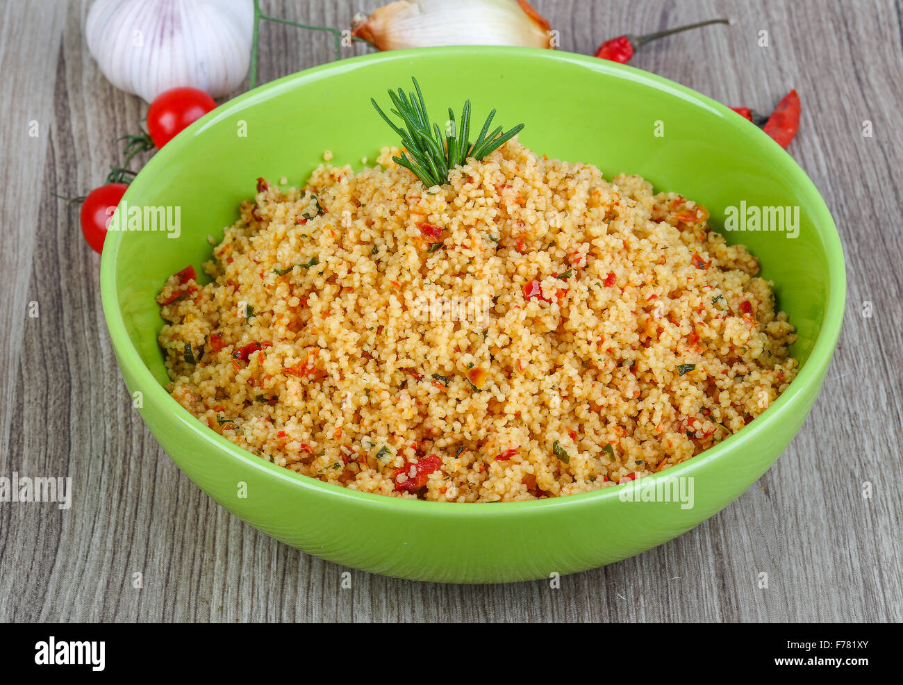 Arabic traditional cuisine Couscous with tomato and green onion Stock
