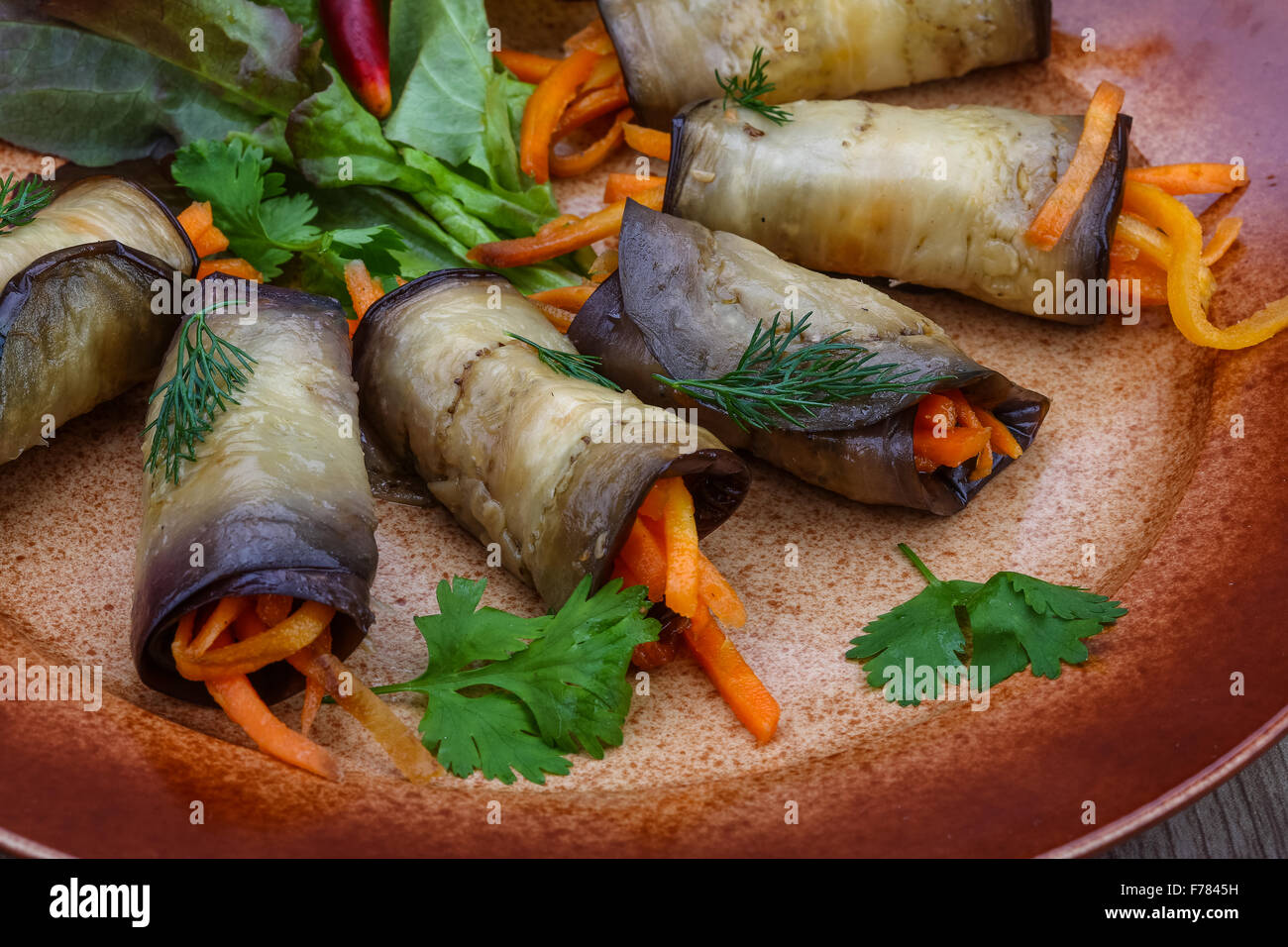 Eggplant rolls with carrot served spices and coriander Stock Photo Alamy