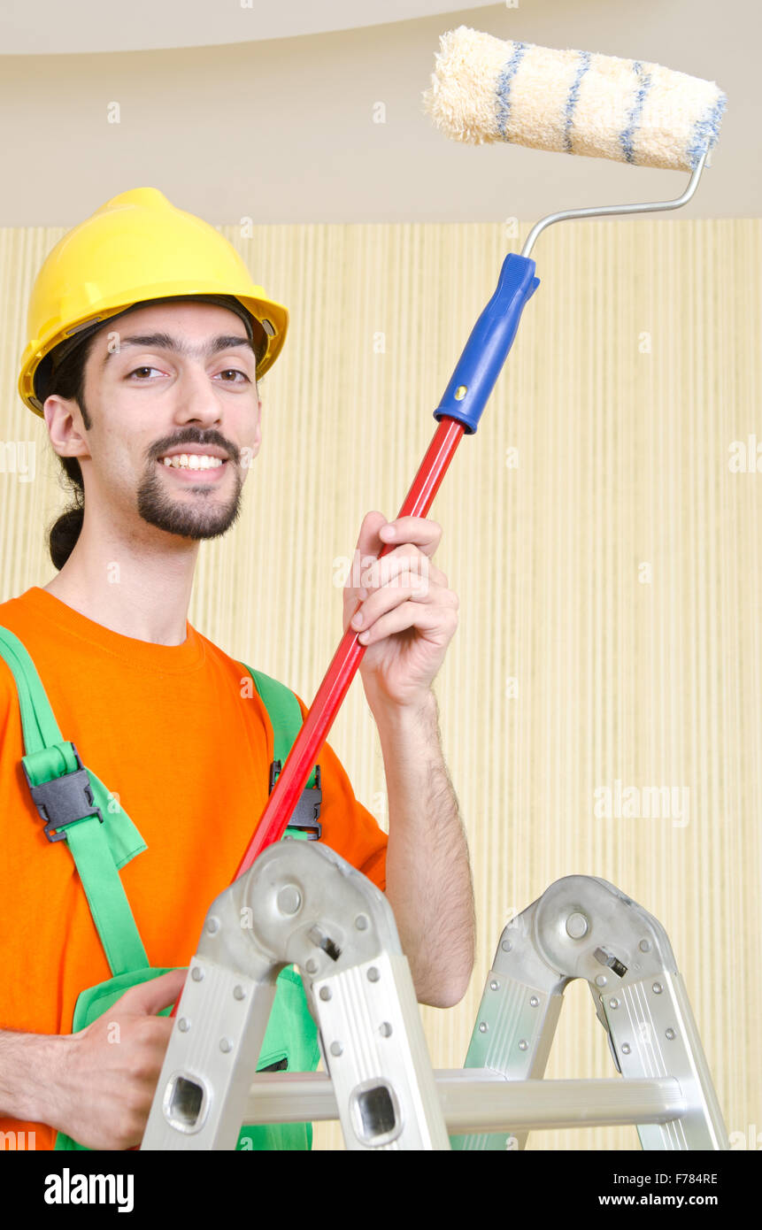 Painter worker during painting job Stock Photo Alamy