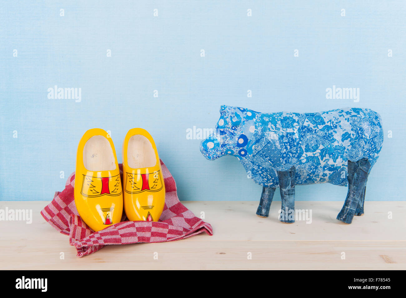 Dutch still life with wooden clogs and cow Stock Photo