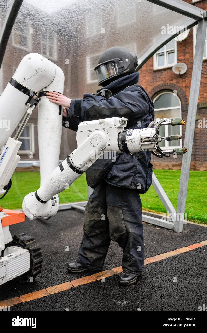 Northern Ireland. 26th November, 2015. A soldier from the Royal Logistics Corp Bomb Defusal Unit adjusts the robotic arm on a Northrop Grumman Andros Cutlass Unmanned Robotic Vehicle used to defuse and examine suspect devices. Credit:  Stephen Barnes/Alamy Live News Stock Photo