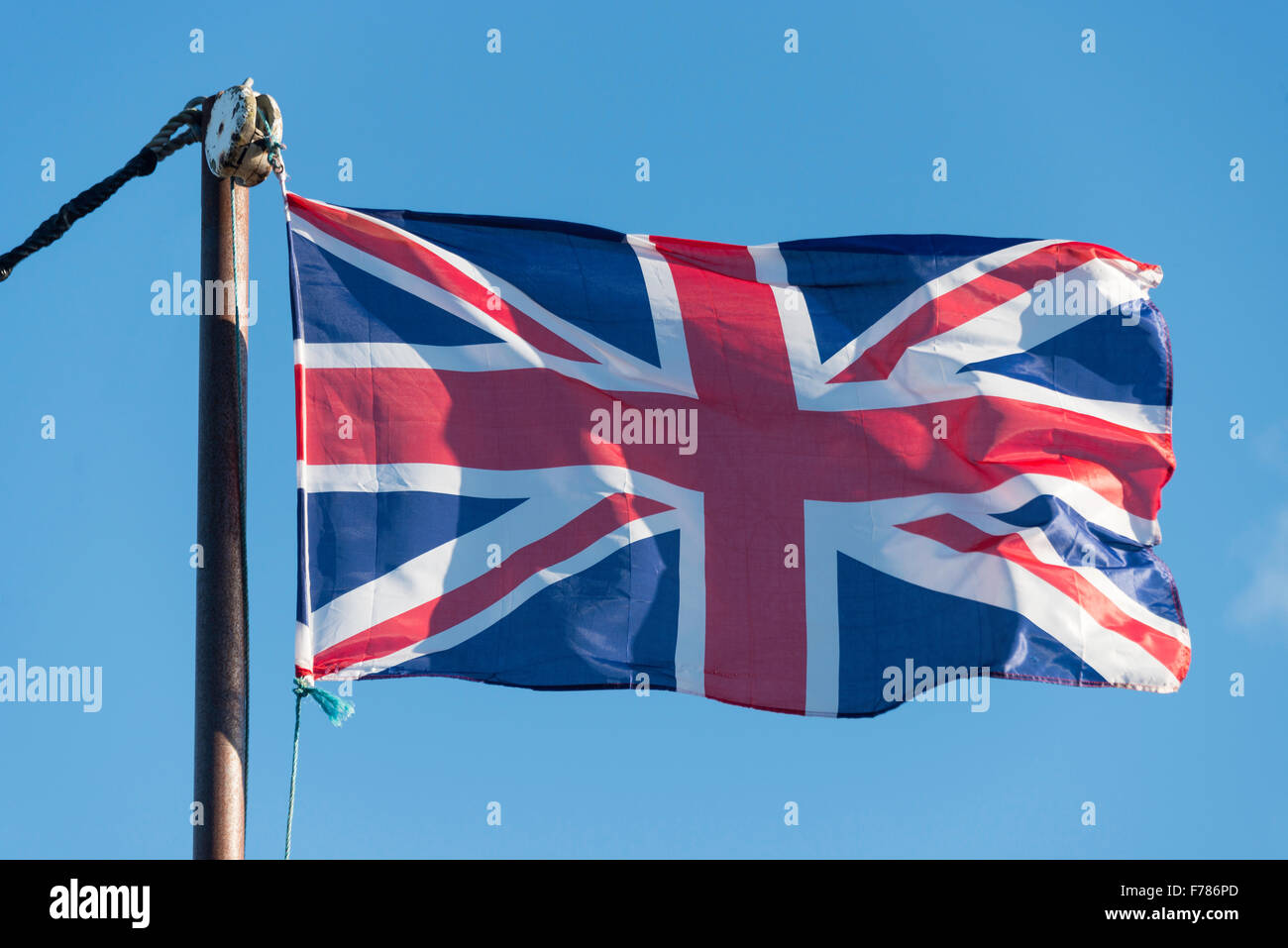 Union Jack flag flying on flagpole, Faversham Creek, Faversham, Kent, England, United Kingdom Stock Photo