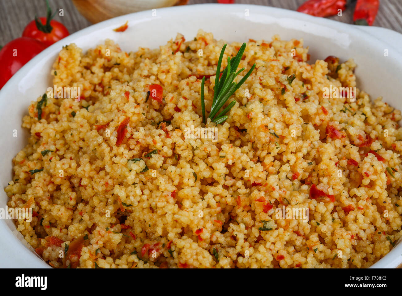 Arabic traditional cuisine Couscous with tomato and green onion Stock