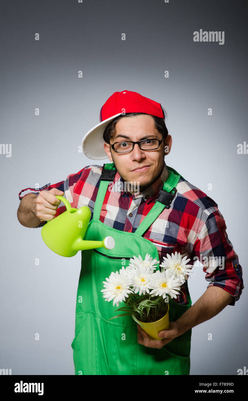 Funny man with watering can Stock Photo Alamy