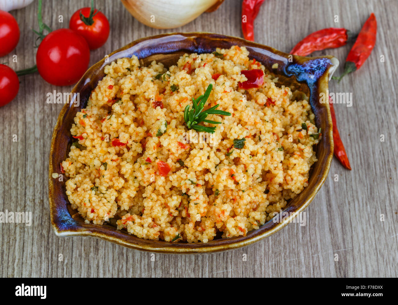 Arabic traditional cuisine Couscous with tomato and green onion Stock