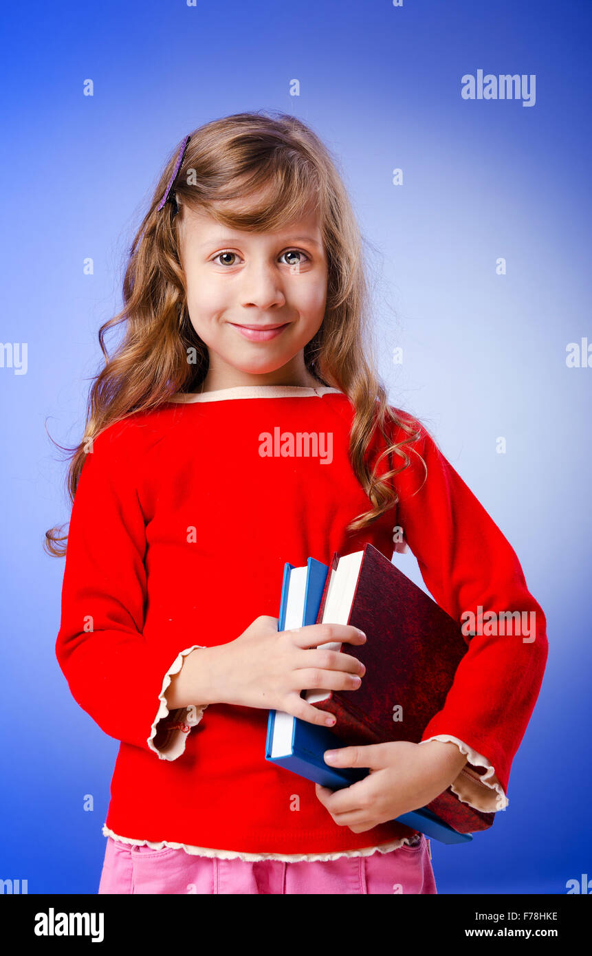 Little girl with books on white Stock Photo - Alamy