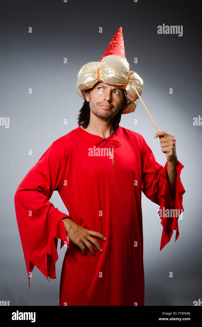 Funny wizard wearing red dress Stock Photo - Alamy
