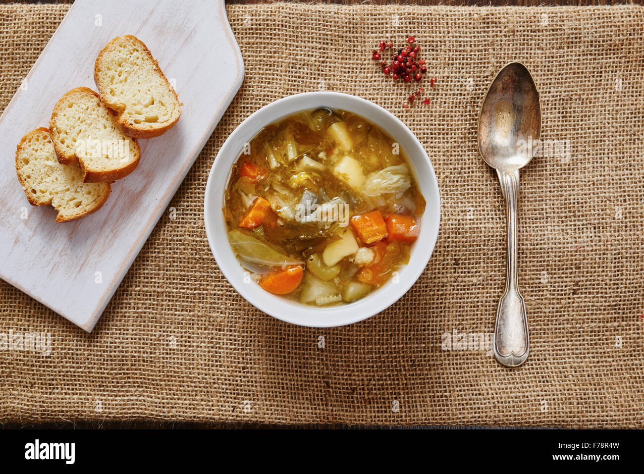 Vegetable soup in white bowl on dark wood table Stock Photo