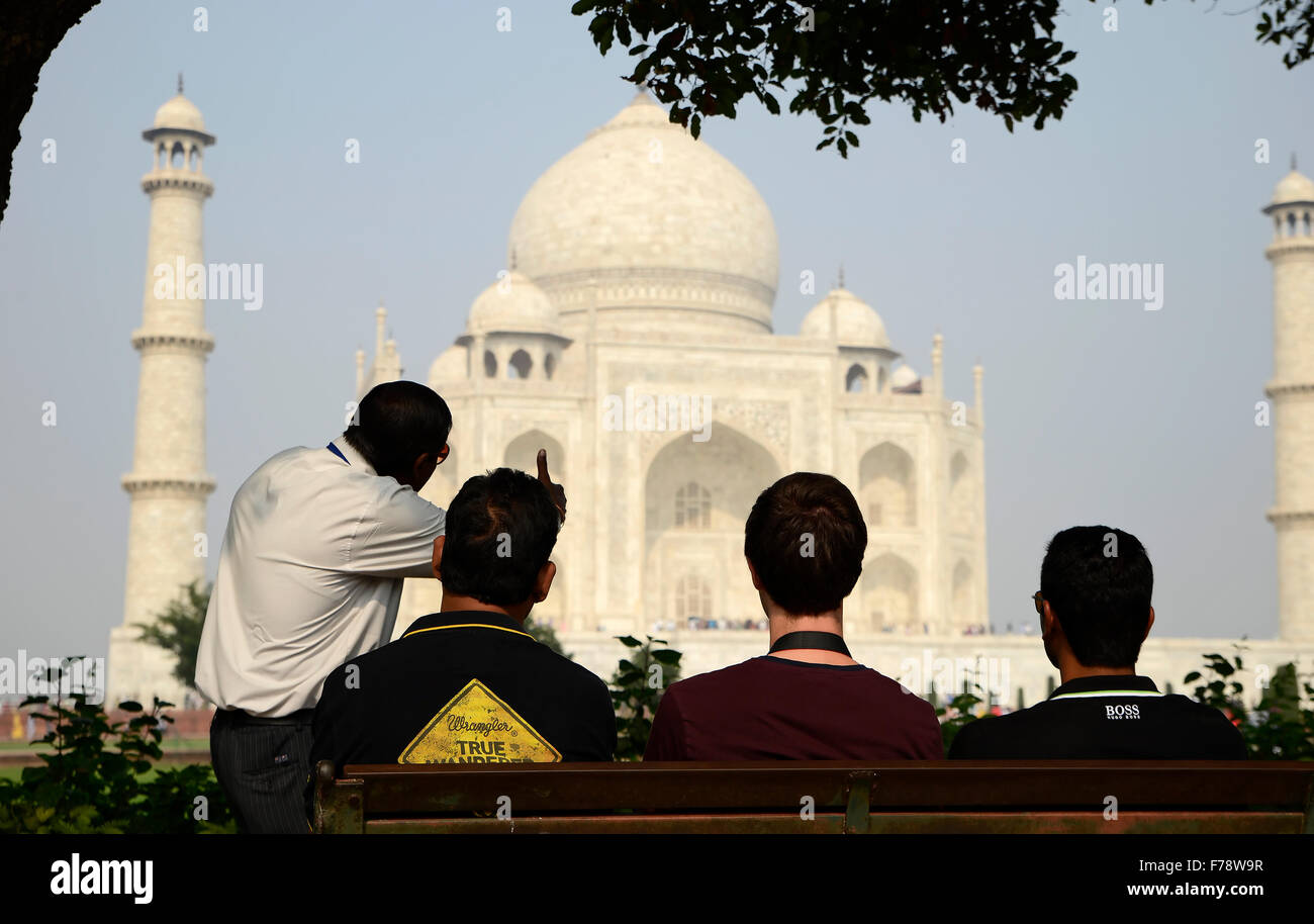A guide to showing the  Taj Mahal to his tourist group and explaining the history of Taj Mahal Stock Photo