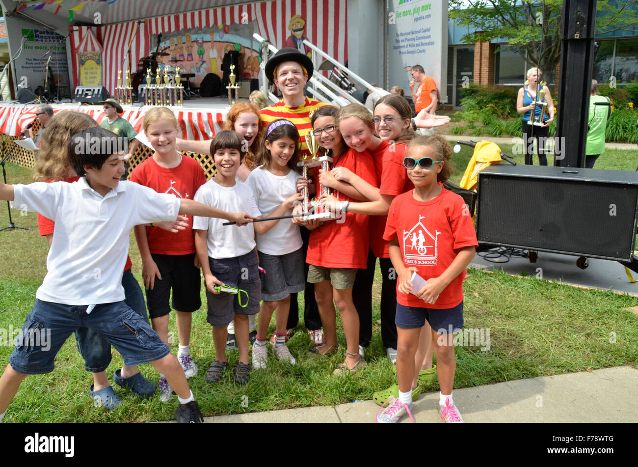 Children pose for pictures after their group won an award at the Greenbelt Labor Day Festival in Greenbelt, Maryland Stock Photo