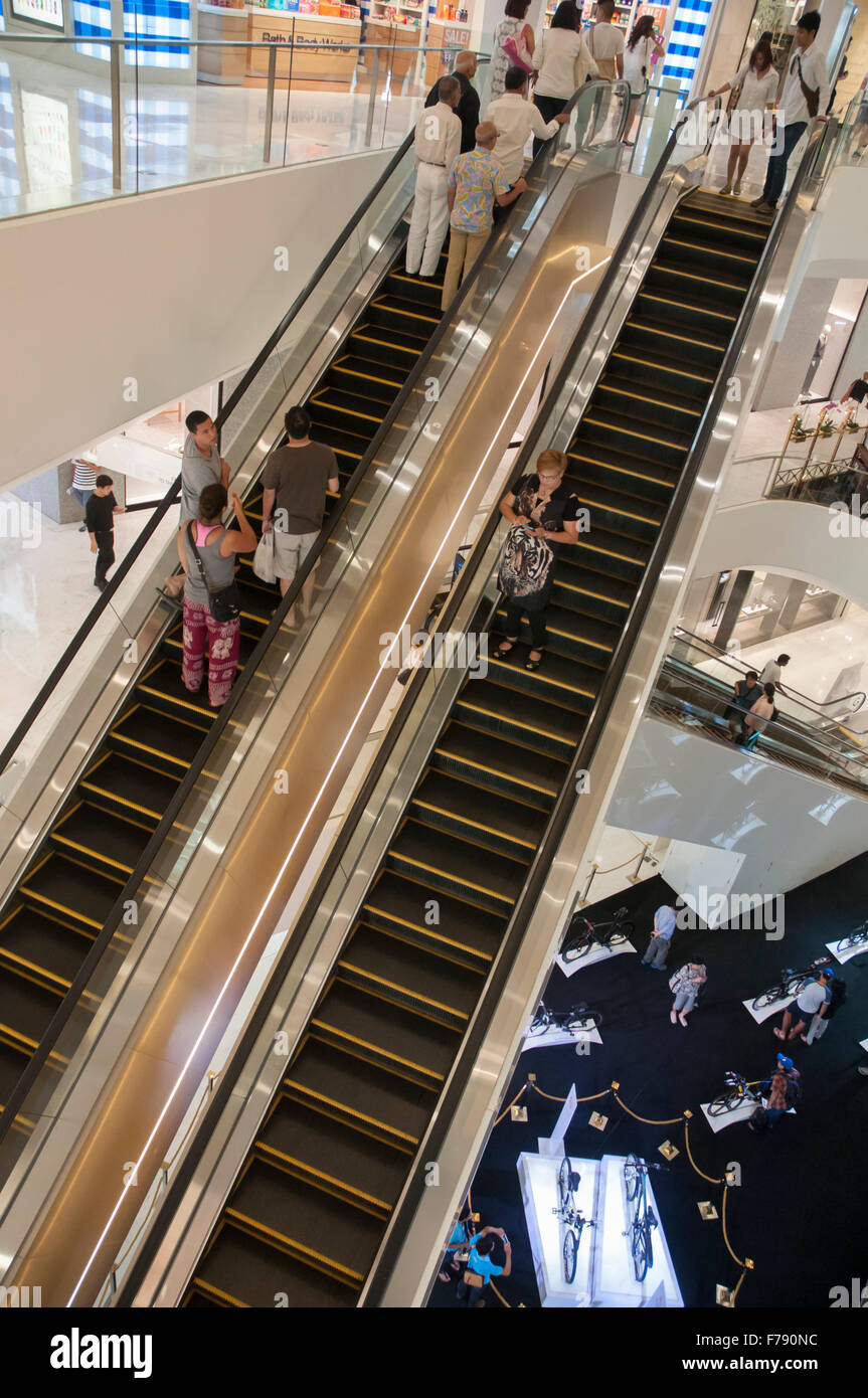 Escalators inside the upscale EM Quartier shopping mall in Sukhumvit, Bangkok, Thailand Stock Photo