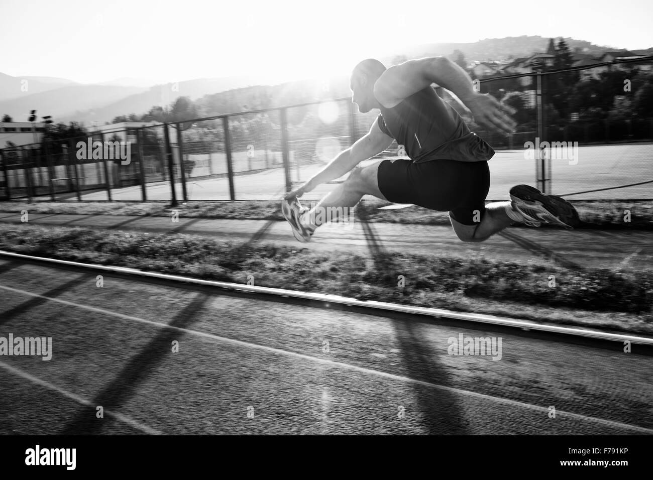 Man on athletics track Black and White Stock Photos & Images - Alamy