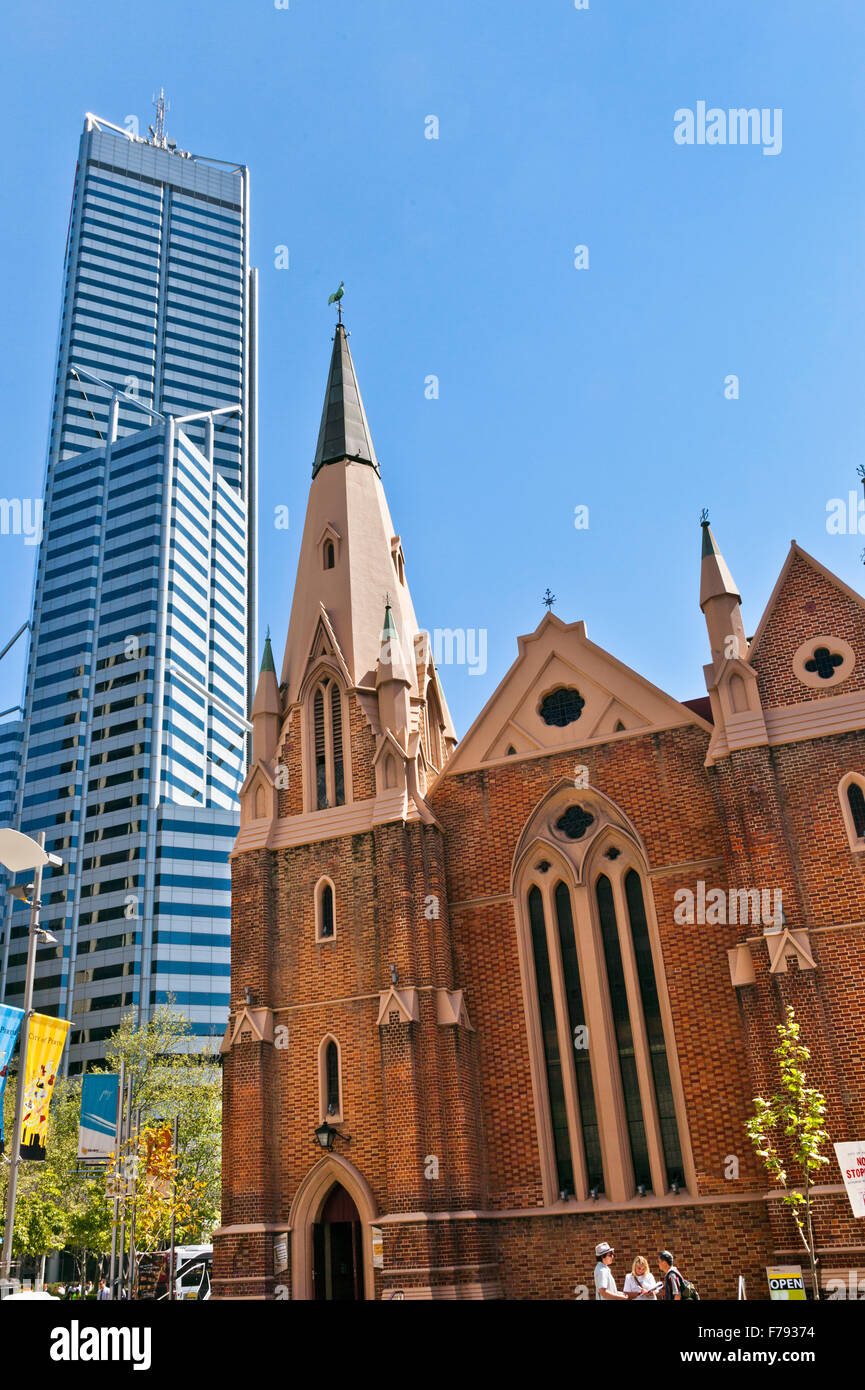 Australia, Western Australia, Perth, the heritage-listed St. Andrew's Uniting Church against soaring Central Park skyscraper Stock Photo