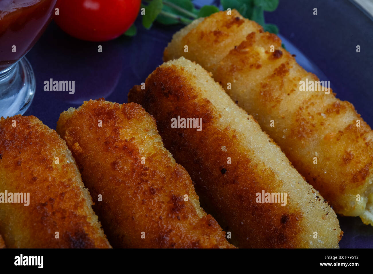 Fry cheese sticks with herbs and tomato sauce Stock Photo Alamy