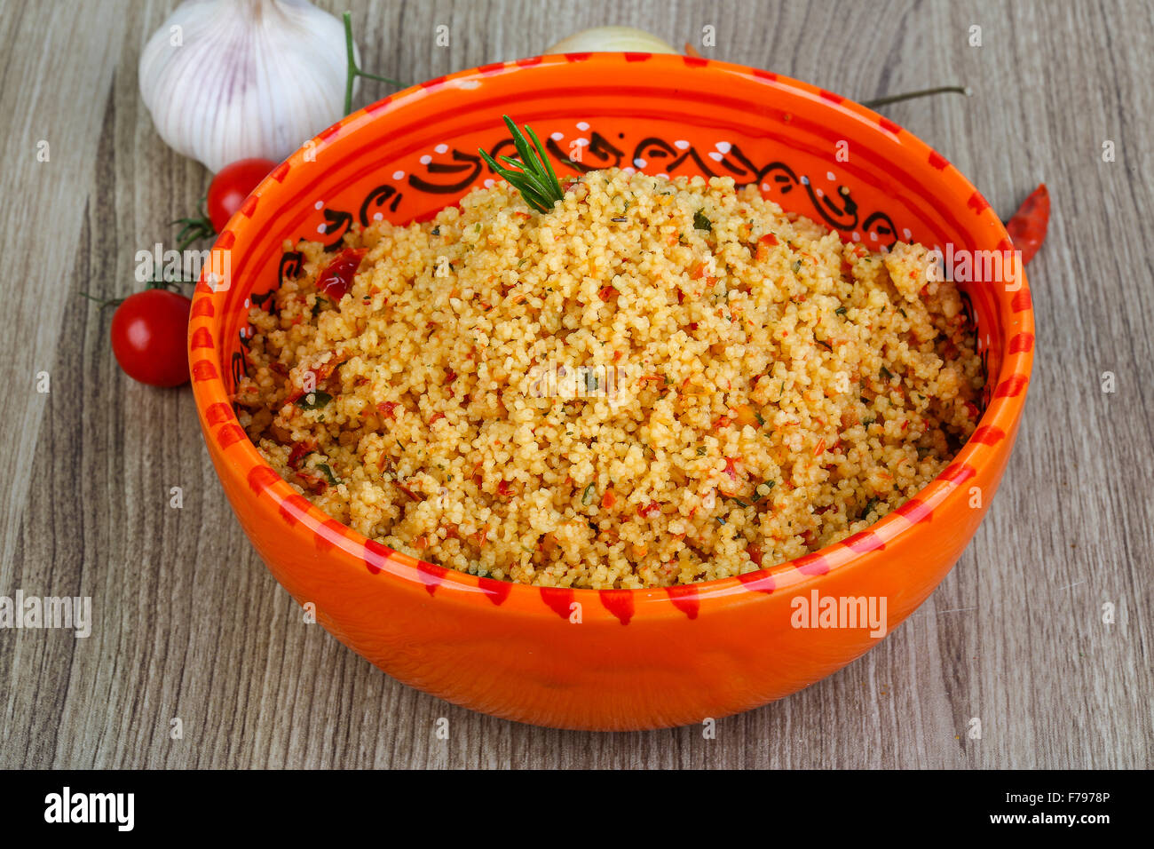 Arabic traditional cuisine Couscous with tomato and green onion Stock