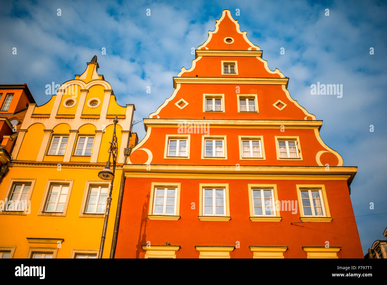 Colorful building facades on the old city center of Wroclaw on cloudy sunny morning Stock Photo