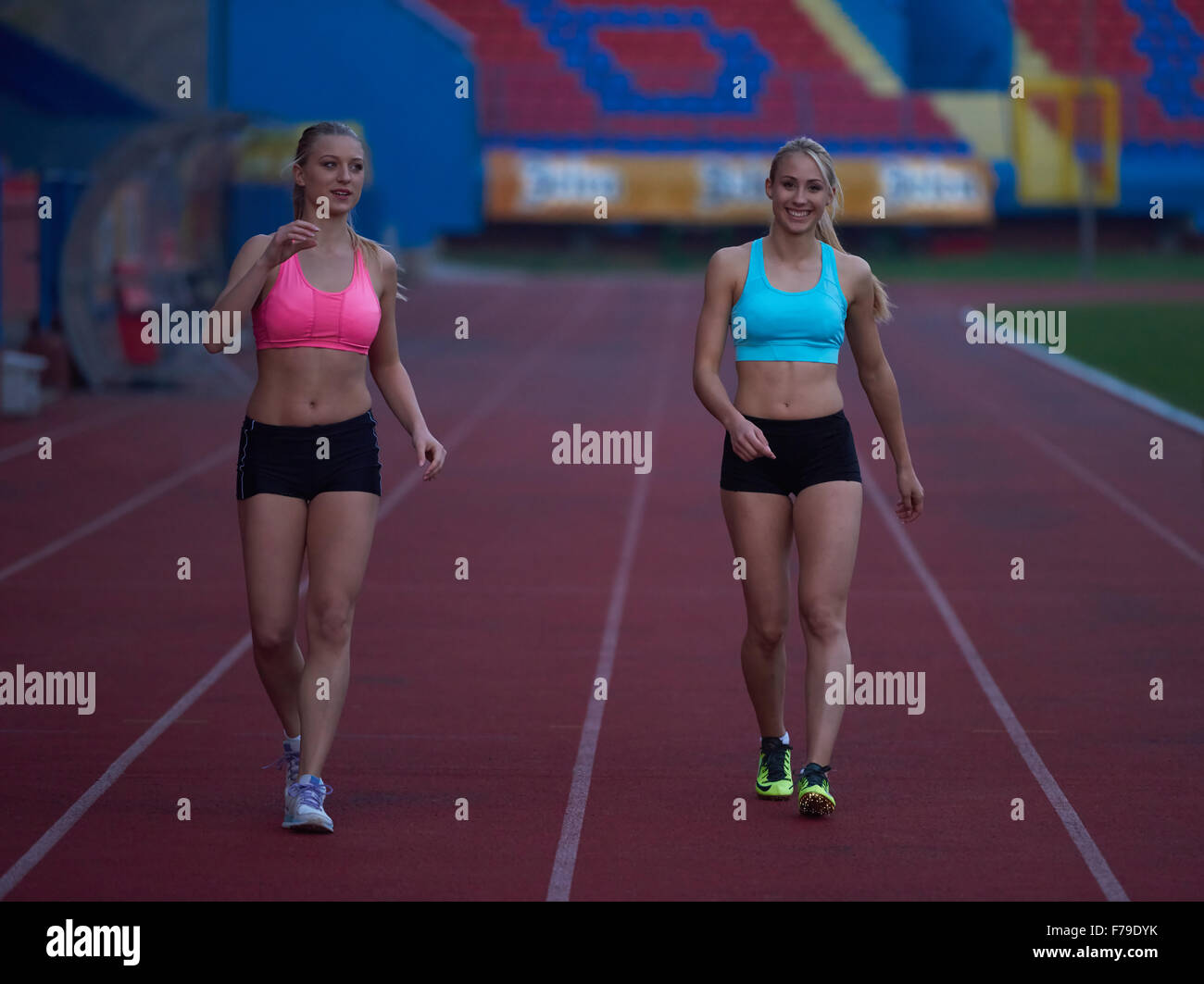 Female Runners Finishing athletic Race Together Stock Photo - Alamy