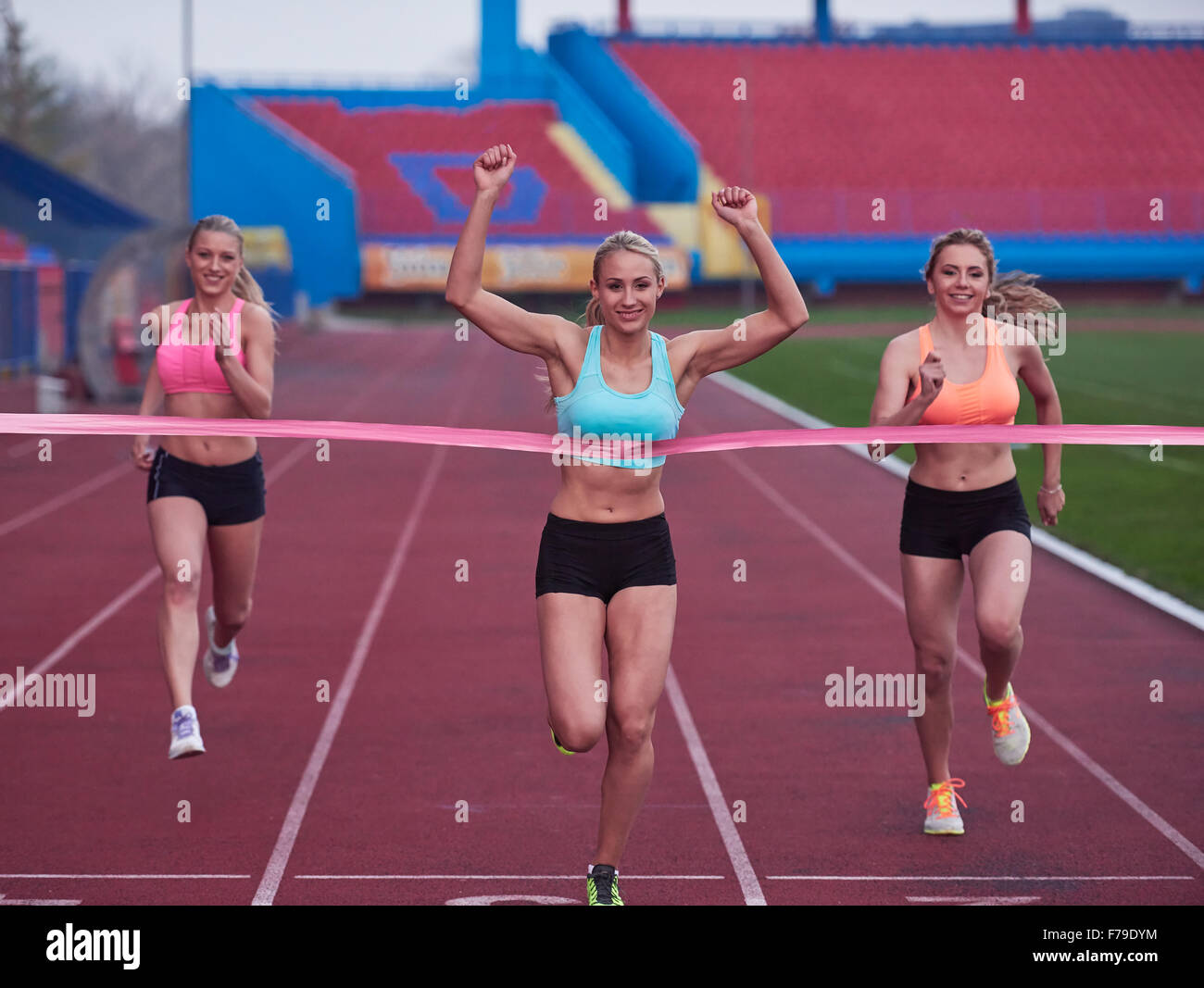 Female Runners Finishing athletic Race Together Stock Photo Alamy