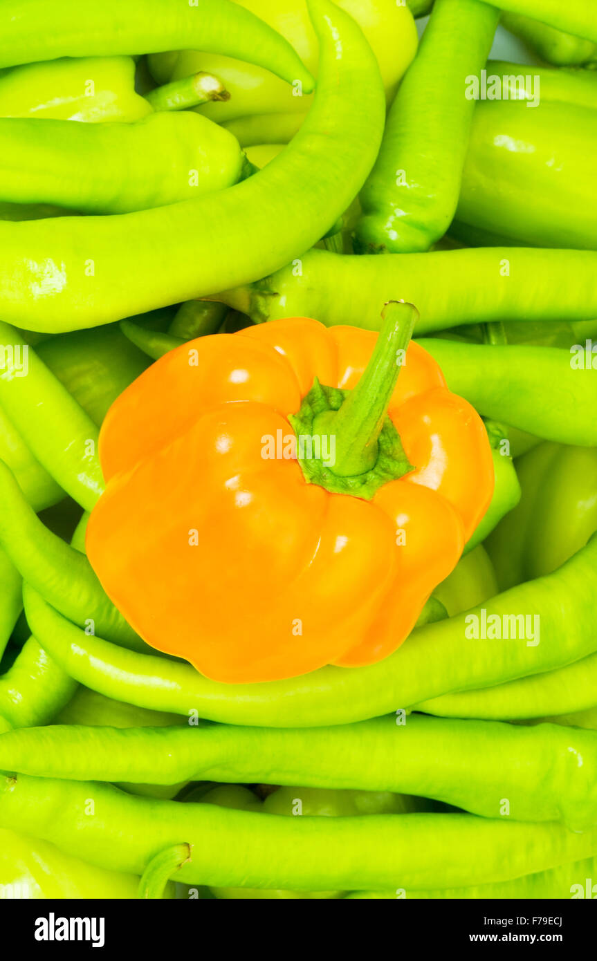 Orange bell pepper and peppers at background Stock Photo Alamy
