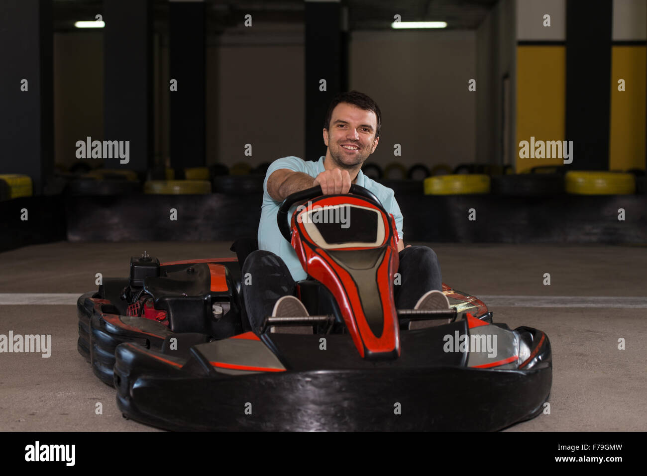 Young Man Is Driving GoKart Car With Speed In A Playground Racing Track Go Kart Is A Popular