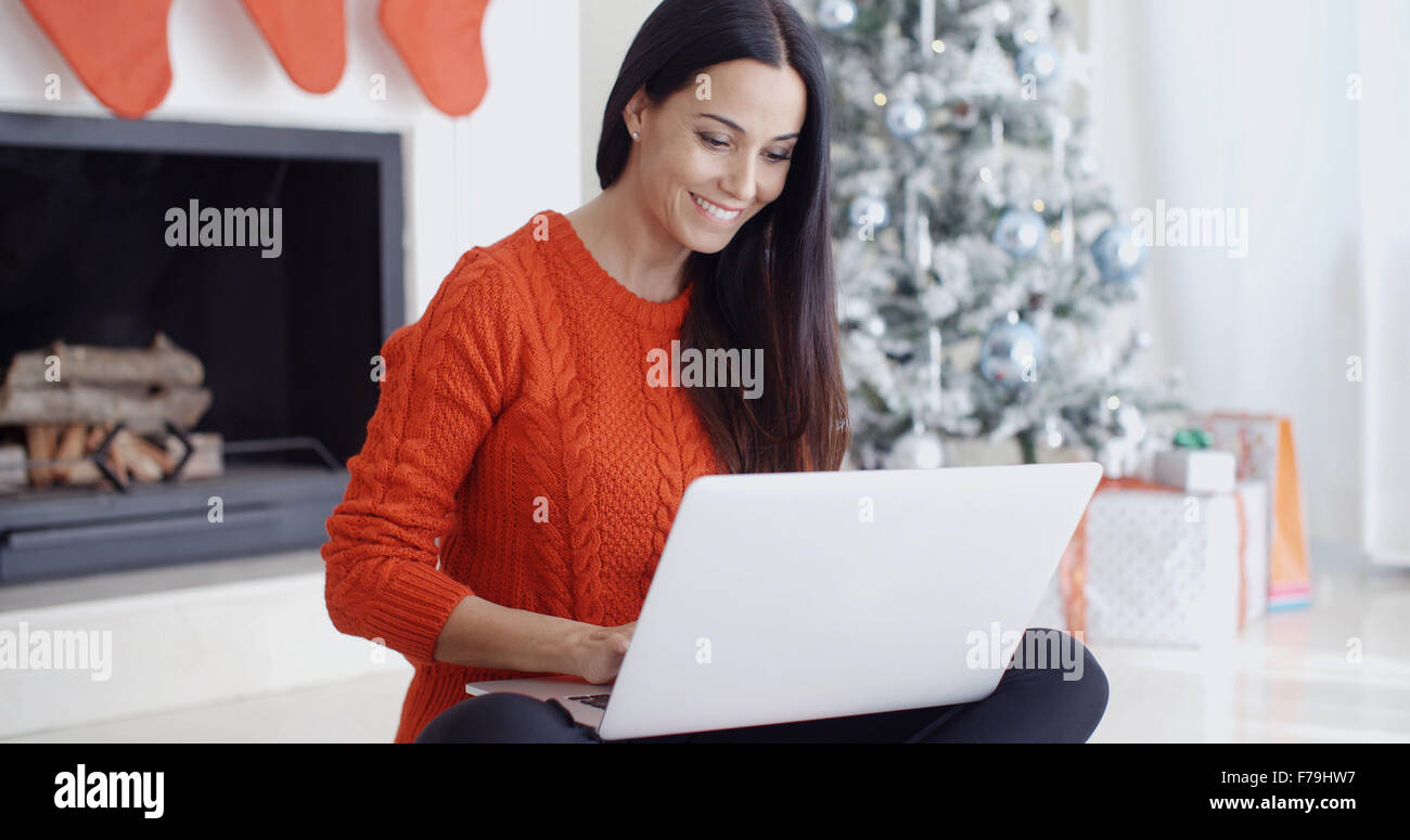 Happy young woman browsing the internet Stock Photo - Alamy