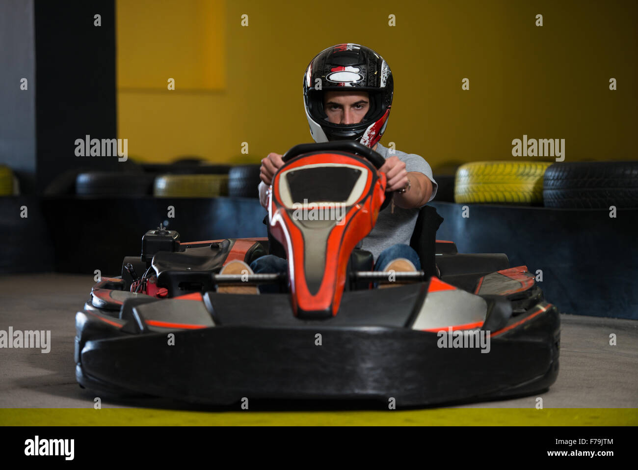 Young Man Is Driving GoKart Car With Speed In A Playground Racing Track Go Kart Is A Popular