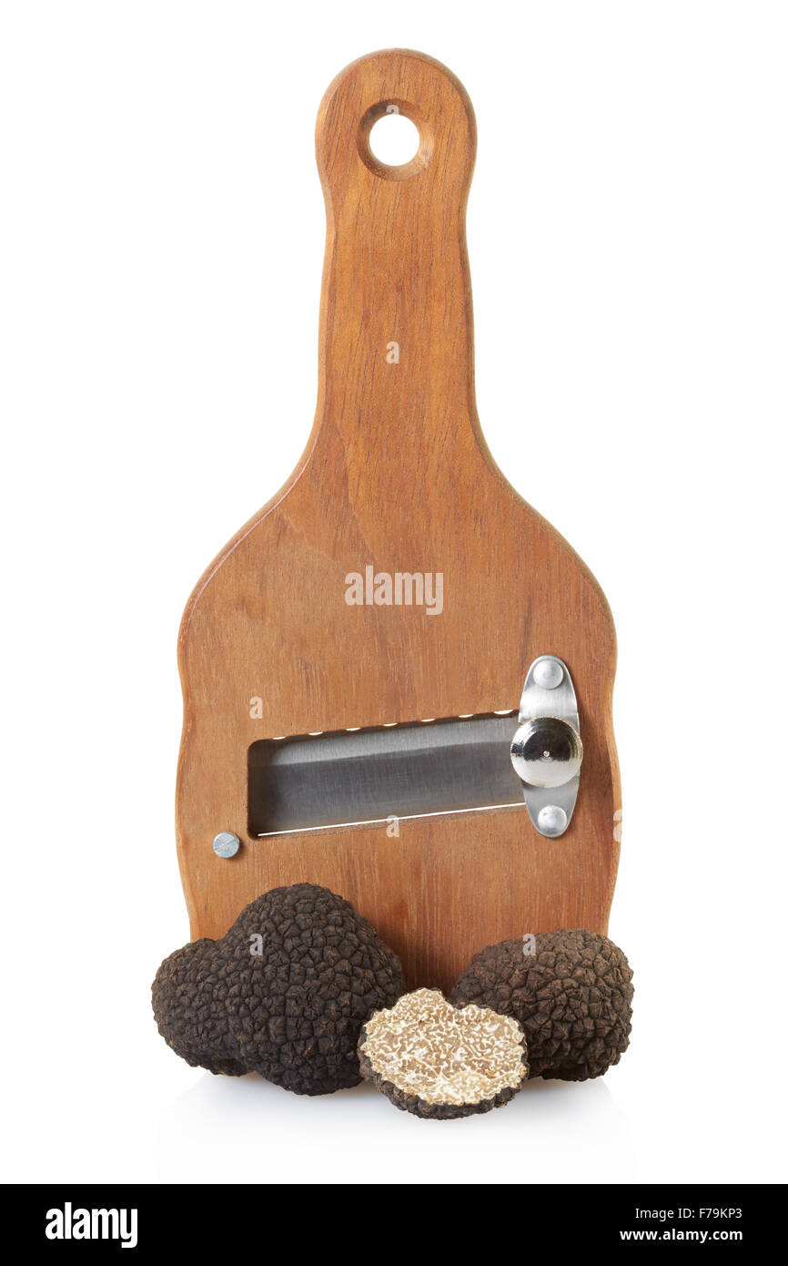 Black truffles and wooden truffle slicer Stock Photo