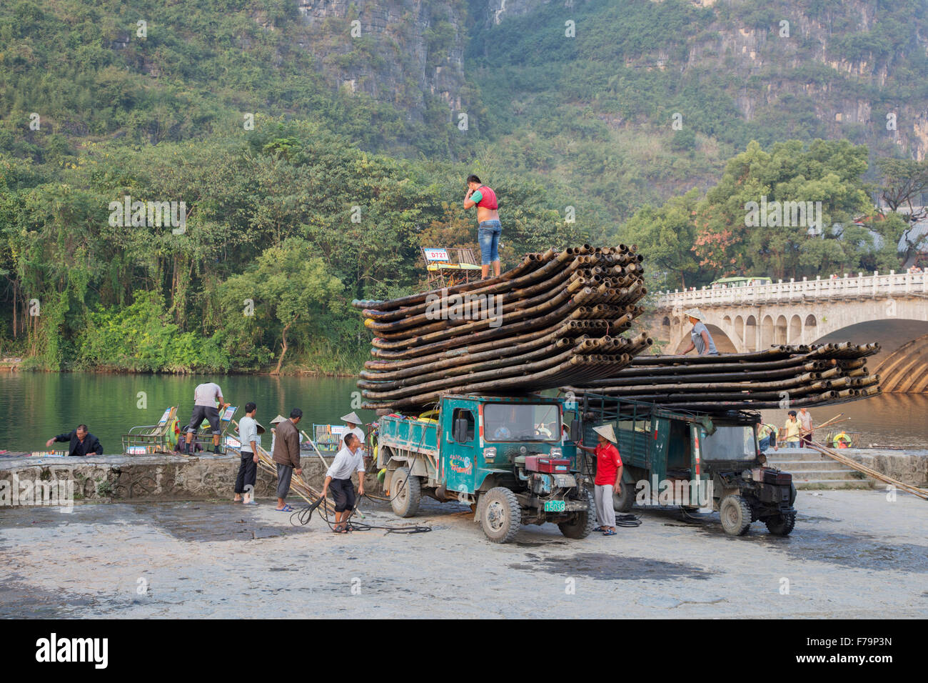 Loading Bamboo Rafts for Transportation up River Guilin Region Guangxi, China LA008200 Stock Photo