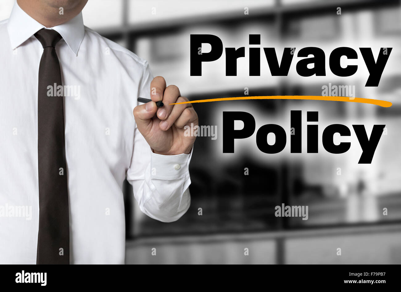 Privacy Policy is written by businessman background concept. Stock Photo