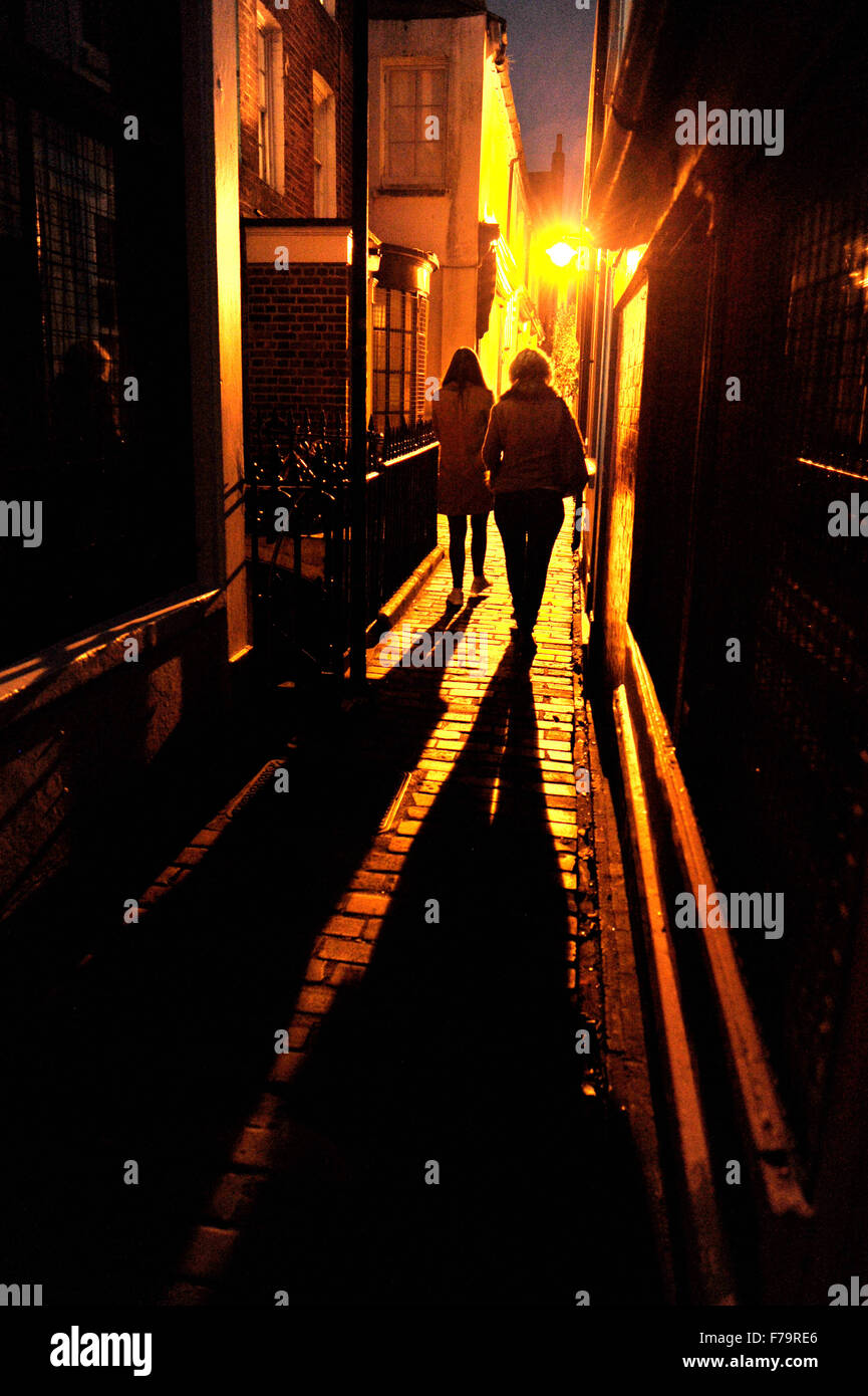 Dark lit alleyway Black Lion Lane in Brighton The Lanes area of city dangerous to walk at night for women Stock Photo