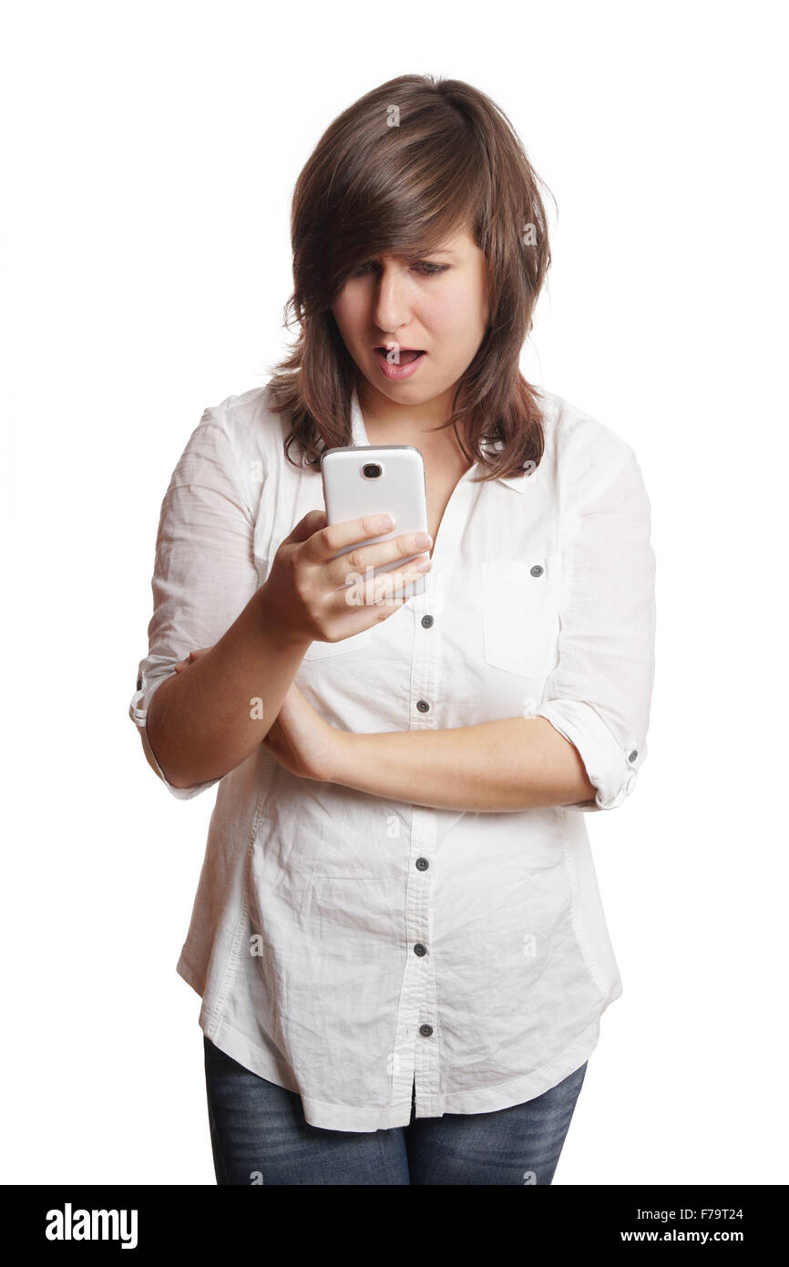 woman staring at smartphone in shock Stock Photo