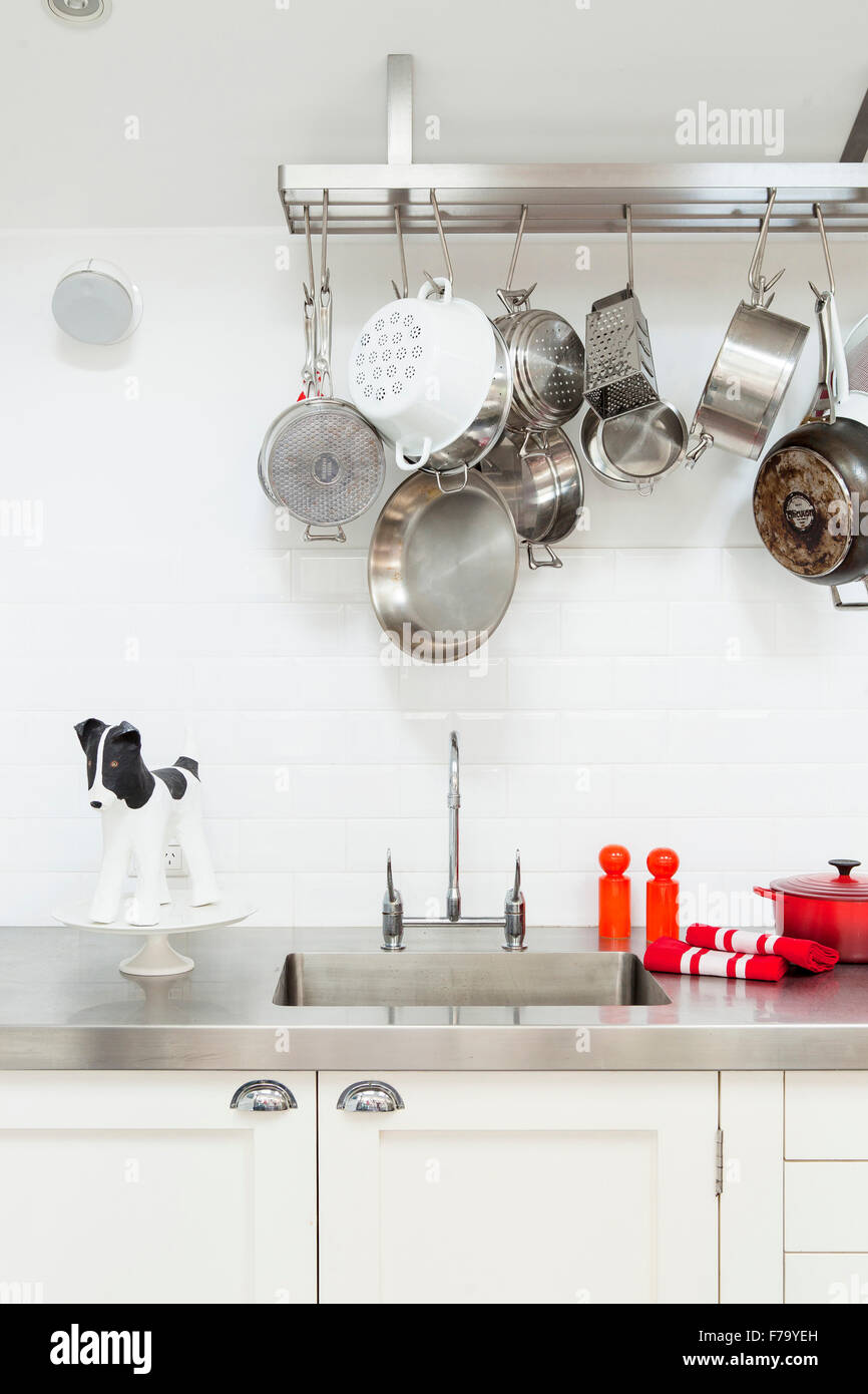 Kitchen detail with pan rack and novelty cake stand in Sydney home of designer and Heritage Consultant Janine Hendry. Stock Photo