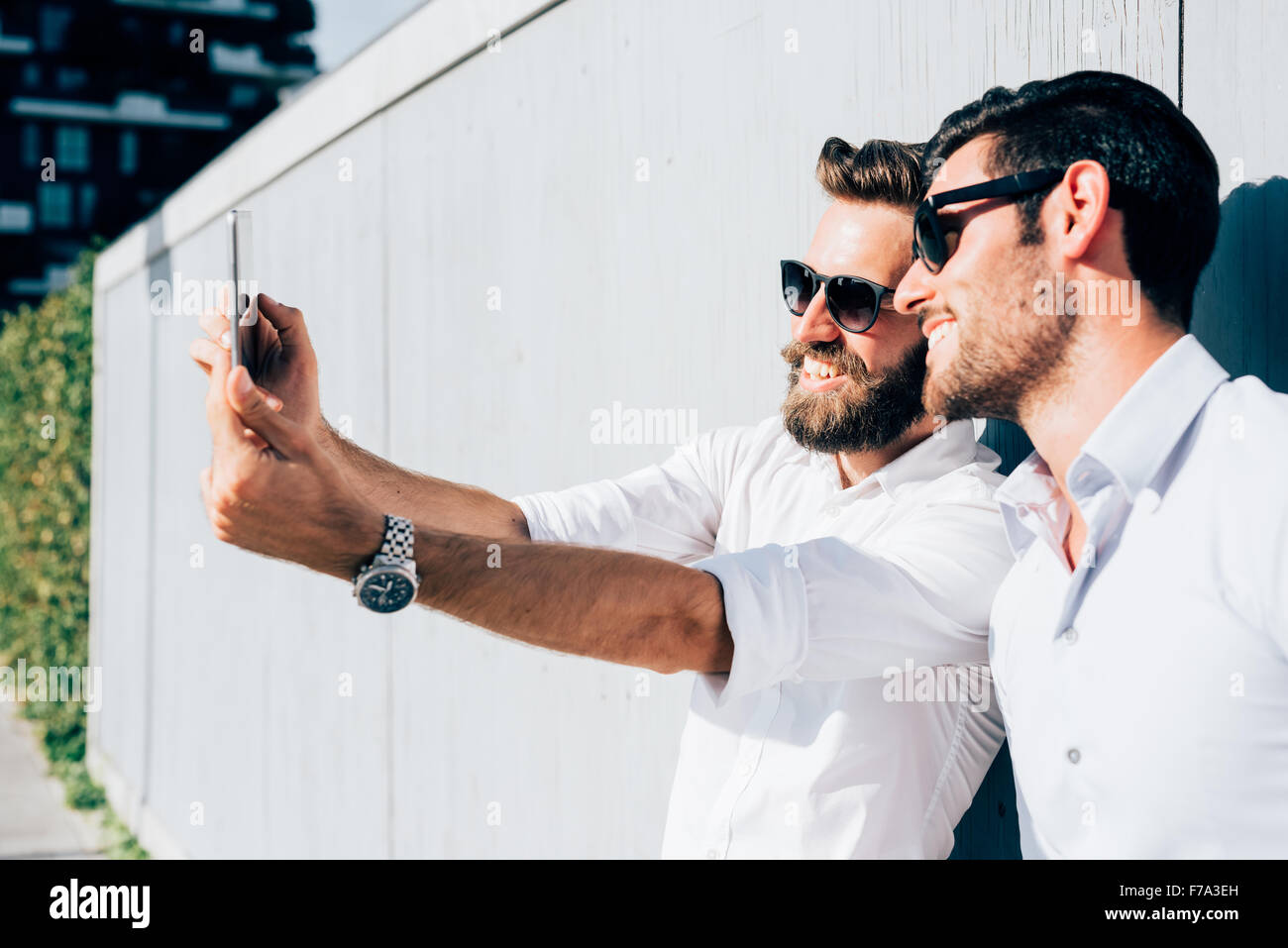 Half Length Of Two Young Bearded Blonde And Black Hair Modern