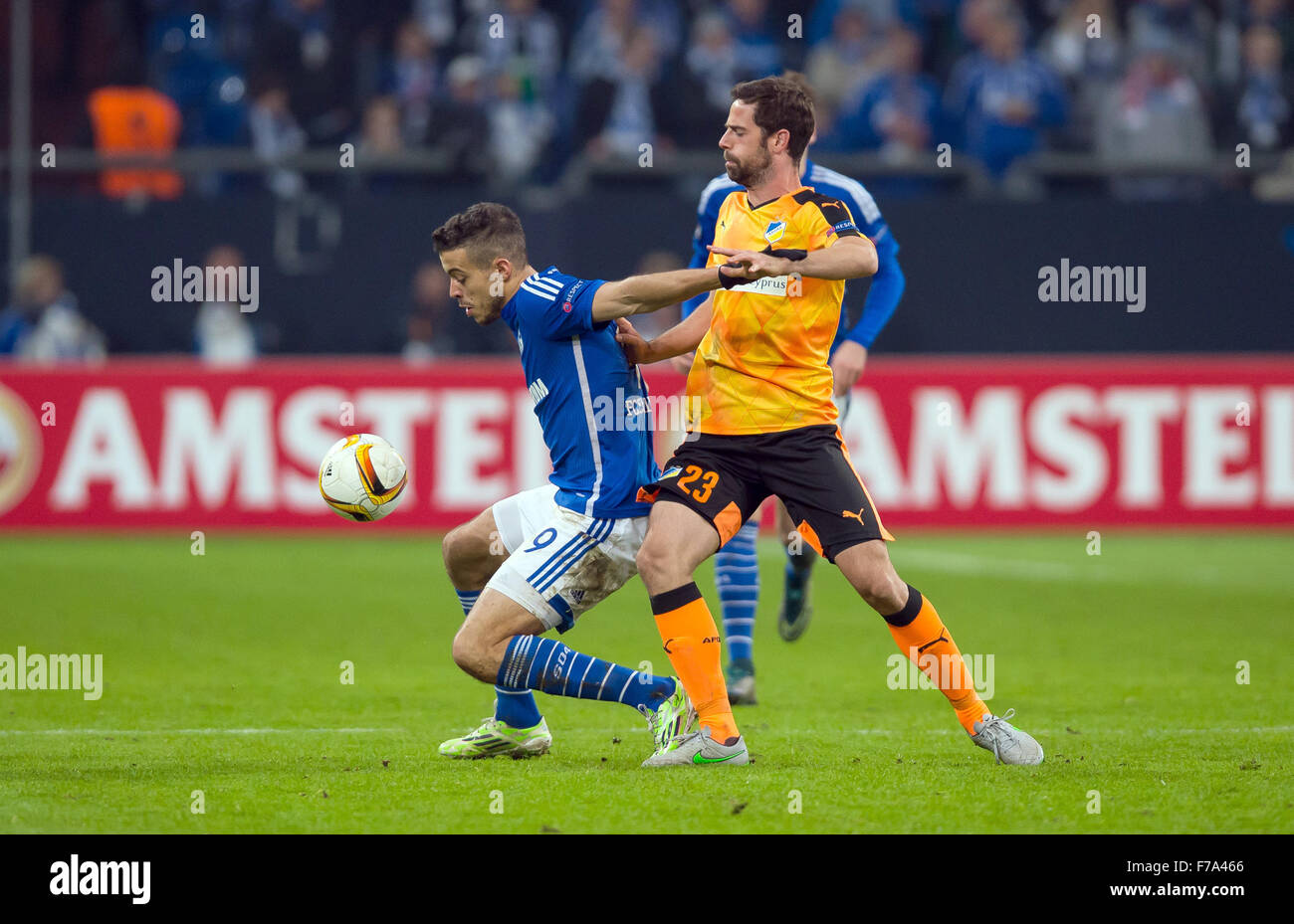 Gelsenkirchen, Germany. 26th Nov, 2015. Schalke's Franco Di Santo (L) and APOEL's Inaki Astiz (R) vie for the ball during the Europa League Group K soccer match between FC Schalke 04 and APOEL Nikosia at the Veltins Arena in Gelsenkirchen, Germany, 26 November 2015. Photo: GUIDO KIRCHNER/dpa/Alamy Live News Stock Photo