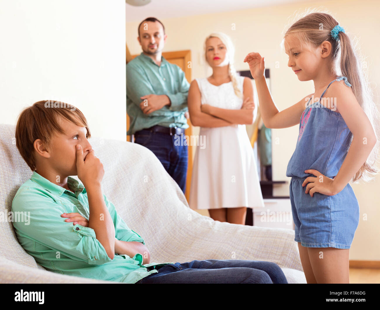 The conflict between brother and sister in presence of parents Stock