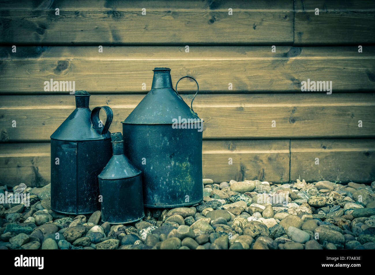 Three vintage tin jugs. Stock Photo
