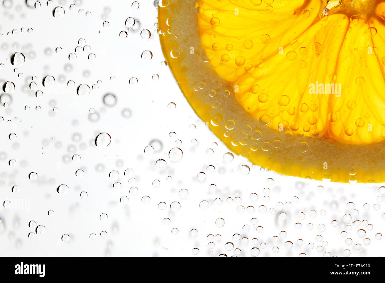 Orange slice in the water with bubbles isolated on white background ...