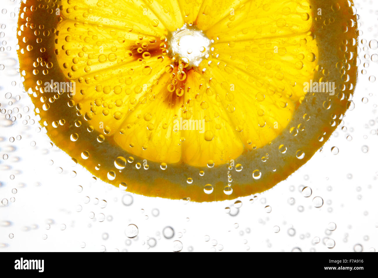 Orange slice in the water with bubbles isolated on white background ...