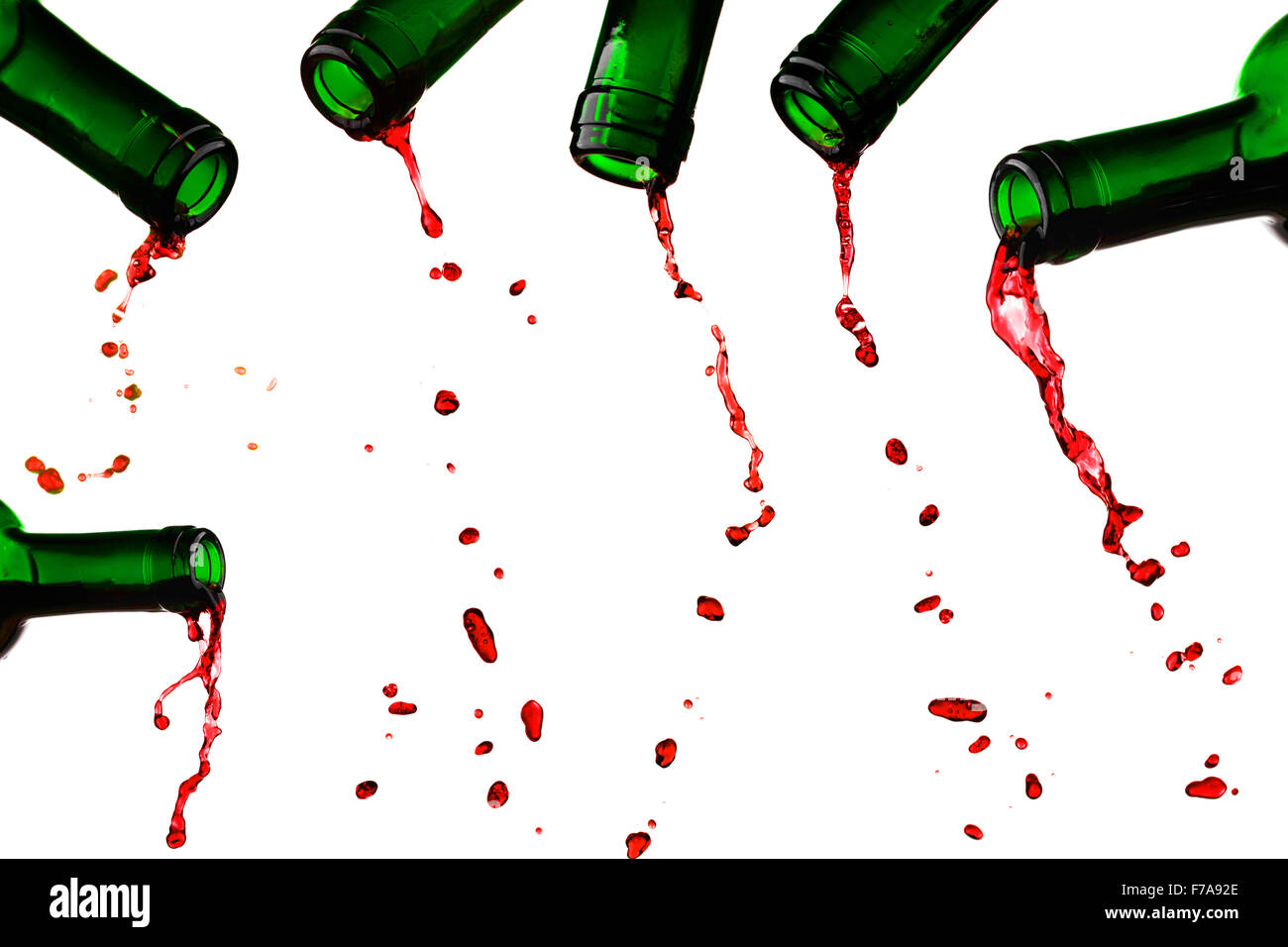 Last red wine drops from bottle set isolated on white Stock Photo Alamy